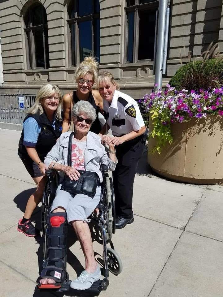 Security team member volunteering and helping homeless community